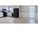 Kitchen featuring stainless steel appliances and door to backyard at 3664 Satellite Ter, Ellenwood, GA 30294