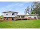 Picture of the backyard showing a large deck overlooking well-maintained lawn at 1619 Folkstone Ne Rd, Brookhaven, GA 30329