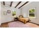 Bedroom with hardwood floors, exposed beams, and lots of natural light at 1619 Folkstone Ne Rd, Brookhaven, GA 30329