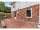 Exterior of brick house with stone patio and stairs at 1619 Folkstone Ne Rd, Brookhaven, GA 30329