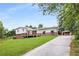 Charming two-story home featuring a spacious yard, detached garage, and wooden deck at 1619 Folkstone Ne Rd, Brookhaven, GA 30329