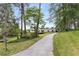 Home set back from the street, surrounded by mature trees, and a long driveway at 1619 Folkstone Ne Rd, Brookhaven, GA 30329