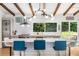 Bright kitchen features a large island, stainless steel appliances, and a window overlooking a lush backyard at 1619 Folkstone Ne Rd, Brookhaven, GA 30329