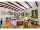 Bright and airy living room featuring wood floors, stylish decor, and slider to deck at 1619 Folkstone Ne Rd, Brookhaven, GA 30329