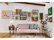 Comfortable living room with bright walls, eclectic art and hardwood floors at 1619 Folkstone Ne Rd, Brookhaven, GA 30329