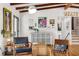 Cozy living area with bright walls, wooden beams, and stylish furniture at 1619 Folkstone Ne Rd, Brookhaven, GA 30329