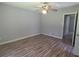 Neutral bedroom featuring updated vinyl flooring and a ceiling fan at 2799 Mockingbird Cir, Duluth, GA 30096