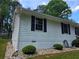 Exterior view of the home, showcasing the siding, black shutters, and well-maintained landscaping at 2799 Mockingbird Cir, Duluth, GA 30096