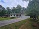 Quaint house with a long driveway and a partial view of the home's porch at 2799 Mockingbird Cir, Duluth, GA 30096