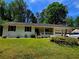 Charming ranch-style home with manicured lawn, attached garage, and welcoming front porch at 2799 Mockingbird Cir, Duluth, GA 30096
