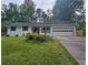 Charming home with a well-manicured lawn, covered porch, and an attached garage at 2799 Mockingbird Cir, Duluth, GA 30096