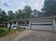 Beautiful ranch-style home features an attached garage, covered porch, and mature landscaping at 2799 Mockingbird Cir, Duluth, GA 30096