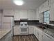 Close up view of kitchen features granite countertops and modern appliances at 2799 Mockingbird Cir, Duluth, GA 30096
