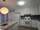 Renovated kitchen with white cabinetry and granite counters at 2799 Mockingbird Cir, Duluth, GA 30096