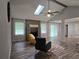 Open-concept living room with vaulted ceilings, stone fireplace, and lots of natural light at 2799 Mockingbird Cir, Duluth, GA 30096