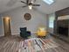 Inviting living room boasts vaulted ceiling, stone fireplace, and laminate wood flooring at 2799 Mockingbird Cir, Duluth, GA 30096