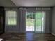Living room with sliding glass doors that look out onto the backyard at 2799 Mockingbird Cir, Duluth, GA 30096