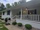 Welcoming covered front porch with a ceiling fan and a comfortable seating area at 2799 Mockingbird Cir, Duluth, GA 30096