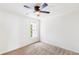 Well-lit room showcases neutral carpet, a ceiling fan, and a bright window at 3022 Kentmere Dr, Cumming, GA 30040