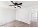 Well-lit room featuring neutral carpet, a ceiling fan, and an open doorway at 3022 Kentmere Dr, Cumming, GA 30040