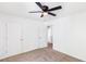 Spacious bedroom with carpet, ceiling fan, and convenient closet access at 3022 Kentmere Dr, Cumming, GA 30040