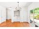 Bright eat-in kitchen features wood floors and convenient laundry access with backyard views at 3022 Kentmere Dr, Cumming, GA 30040