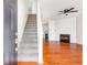 Inviting entryway flows into a living room with fireplace and hardwood floors at 3022 Kentmere Dr, Cumming, GA 30040