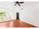 Hardwood floors highlight the living room with plentiful natural light and staircase at 3022 Kentmere Dr, Cumming, GA 30040