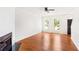 Bright living room features hardwood floors and large windows for natural light at 3022 Kentmere Dr, Cumming, GA 30040