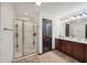Bathroom with a double vanity, a large mirror, and a tiled stand up shower at 4430 Cedar Bridge Walk, Suwanee, GA 30024