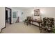 Carpeted hallway with decorative furnishings and access to other rooms at 4430 Cedar Bridge Walk, Suwanee, GA 30024
