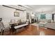 Open floorplan with living and dining areas featuring hardwood floors, fireplace, and lots of natural light at 4430 Cedar Bridge Walk, Suwanee, GA 30024