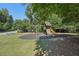 Community playground featuring a swing set, a climbing structure, and a slide at 4430 Cedar Bridge Walk, Suwanee, GA 30024