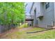 View of the backyard featuring a deck and wooded fence line at 535 Pierpoint Dr, Atlanta, GA 30331