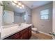 Bathroom with vanity, light bar, window, and combination shower-tub at 535 Pierpoint Dr, Atlanta, GA 30331