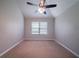 Bright bedroom features neutral walls, carpet, and a ceiling fan at 535 Pierpoint Dr, Atlanta, GA 30331