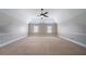 Spacious bedroom with high ceilings, carpet flooring, and natural light offers a comfortable and relaxing atmosphere at 535 Pierpoint Dr, Atlanta, GA 30331