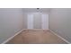 Spacious bedroom with neutral walls, carpet, and two white paneled doors at 535 Pierpoint Dr, Atlanta, GA 30331