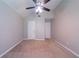 Spacious bedroom with neutral walls, carpet, and two white paneled doors at 535 Pierpoint Dr, Atlanta, GA 30331