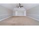 A large empty room featuring neutral colors and carpet flooring allows for versatile use and personalization at 535 Pierpoint Dr, Atlanta, GA 30331