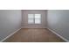 A simple empty room with carpet flooring and a window offering plenty of natural light at 535 Pierpoint Dr, Atlanta, GA 30331
