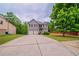 Charming two-story home featuring a two-car garage and a well-manicured front lawn at 535 Pierpoint Dr, Atlanta, GA 30331