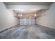 Spacious two-car garage with concrete floors, two garage doors, and electric door openers at 535 Pierpoint Dr, Atlanta, GA 30331