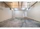 Bright, spacious two-car garage with two electric door openers, a side door, and concrete floors at 535 Pierpoint Dr, Atlanta, GA 30331