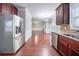 Bright kitchen with stainless steel refrigerator and cherry cabinets at 535 Pierpoint Dr, Atlanta, GA 30331