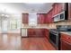 Well-appointed kitchen featuring cherry cabinets and stainless steel appliances at 535 Pierpoint Dr, Atlanta, GA 30331