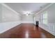 Spacious living room with hardwood floors, a fireplace, and stylish trim at 535 Pierpoint Dr, Atlanta, GA 30331