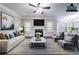 Bright living room with stylish furniture, a fireplace, and large windows offers a cozy and inviting atmosphere at 535 Pierpoint Dr, Atlanta, GA 30331