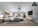 A primary bedroom with neutral colors, a ceiling fan, and artwork provides a relaxing and inviting retreat at 535 Pierpoint Dr, Atlanta, GA 30331