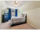Bedroom featuring neutral walls, a ceiling fan, window with blinds and curtains, a bed, and chest of drawers at 545 Creek Landing Ln, Alpharetta, GA 30005